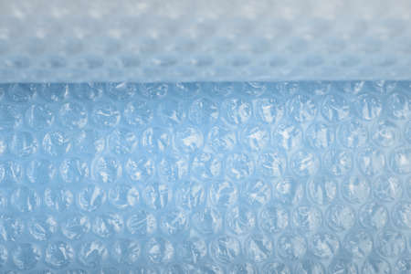 Bubble wrap background toned in blueの写真素材