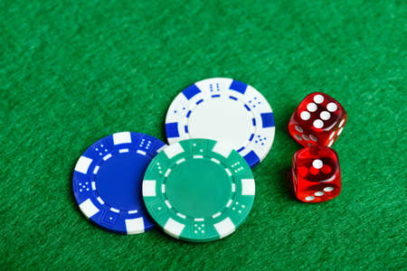 Casino green table with chips and dices. Poker game concept