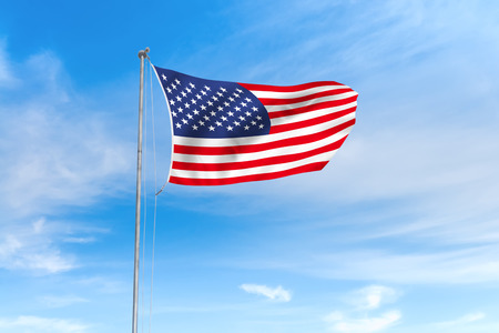 United States USA American flag blowing in the wind over nice blue sky background