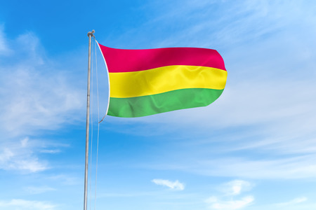 Bolivia flag blowing in the wind over nice blue sky backgroundの写真素材