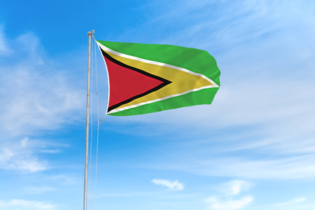 Guyana flag blowing in the wind over nice blue sky backgroundの写真素材