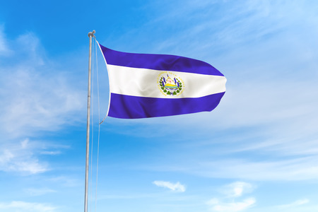 El Salvador flag blowing in the wind over nice blue sky backgroundの写真素材