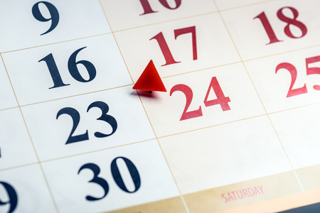 Calendar fragment perspective shot with partial blurred areas. Number 24 in focusの写真素材