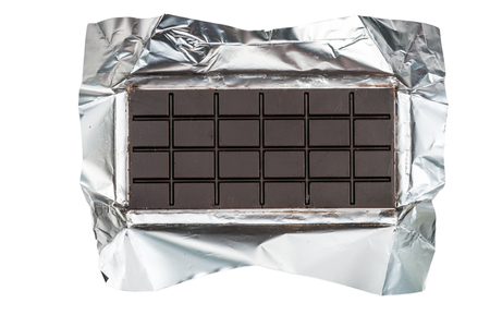 Top view chocolate bar at foil isolated on white with clipping pathの写真素材