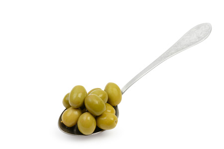 Spoon with wet green olives in brine isolated on white background with clipping pathの写真素材