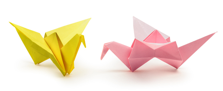 Color origami flying bird isolated with clipping path. Japanese folded paper swan. Peace and hope symbolの写真素材