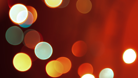 Abstract blurred red glowing Christmas lights backgroundの写真素材