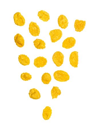 Many corn flakes isolated on white background. Falling cornflakes