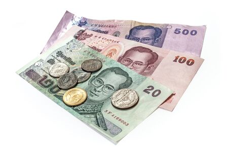 Thailand money close up paper currency and coins isolated over white with clipping path