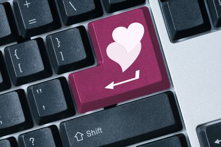 Find love Keyboard pink button with heart shape concept imageの写真素材