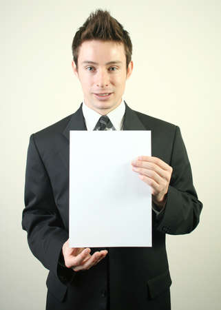 Man holding the white paper. の写真素材
