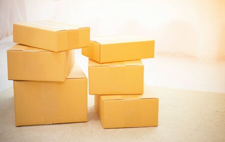 Arrangement of empty cardboard packing boxes standing on a floor with copy space