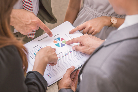 Business people hands pointing to the document at the work placeの写真素材