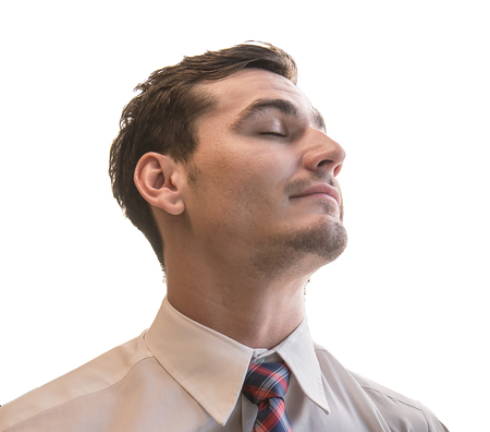 Portrait of a smiling business man (professional), young business man chin up with his eyes closedの写真素材