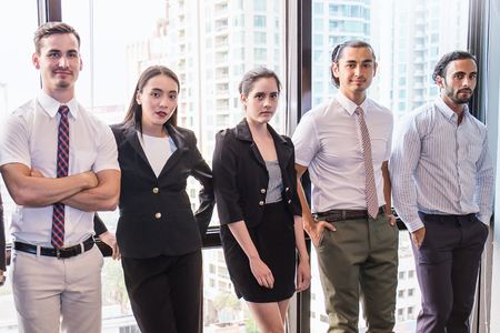 Portrait of confident business people group standing in row, teamwork multicultural and togetherness concept, mixed race business man and woman stand in line indoorsの写真素材