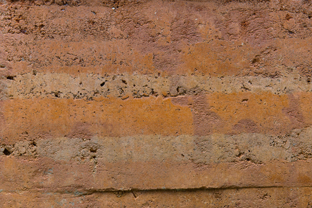 Layers earth soil of natural geology, orange soil wallpaper background.の写真素材