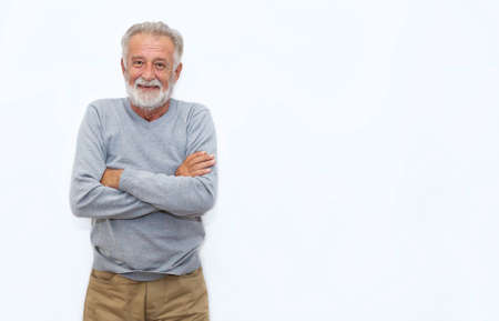 Portrait of healthy happy smile senior elderly caucasian old man face with arm crossed isolated on white. Golden age grand father healthcare cheerful lifestyle, freedom relax retirement conceptの写真素材