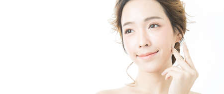 Closeup portrait of attractive asian woman skin care image isolated on white background, asian beautiful girl with pretty smile on her face. Beauty clinic and surgery concept bannerの写真素材