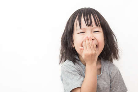 Closeup portrait of little cute very happy asian girl, lovely small asian girl happy and fun expression isolated on white background. Education conceptの写真素材