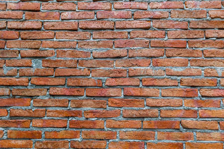 Red brick wall old style vintage background. Copy space of orange brick wallpaper grunge retro vintage conceptの写真素材