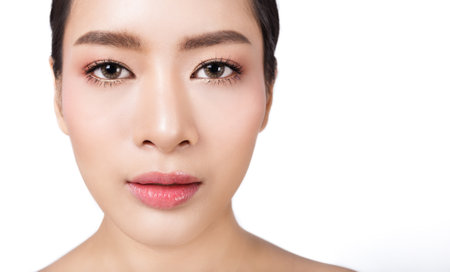 Closeup eyes face and portrait of attractive asian woman with fair perfect healthy glow skin , asian beautiful girl. Beauty clinic tanned skincare vision and surgery conceptの写真素材