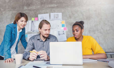 Portrait of young designer giving new ideas  project to partners in conference room. Business people discussing over new business project in office. Technology communication brainstorm teamwork together concept.の写真素材