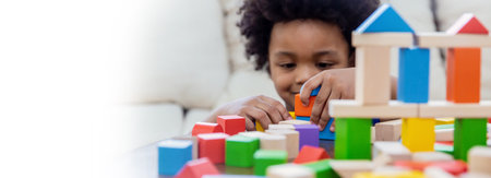 Little boy hands of little children play blocks in classroom. Learning by playing education group study concept. International pupils do activities brain training in primary school background bannerの写真素材
