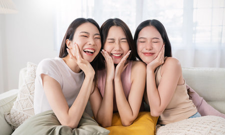 Closeup portrait of young beautiful asian group of friends girl in morning makeup routine. Beauty blogger woman with perfect glow skin dress up. Health care woman, together lifestyle cosmetic bloggerの写真素材