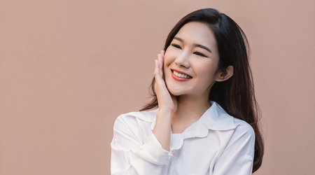 Portrait smile happy beautiful innocence asian woman relax. Asian girl face on white shirt Beauty long hair spa woman treatment perfect clear cosmetology skin. Japanese girl makeup lifestyle lifestyleの写真素材