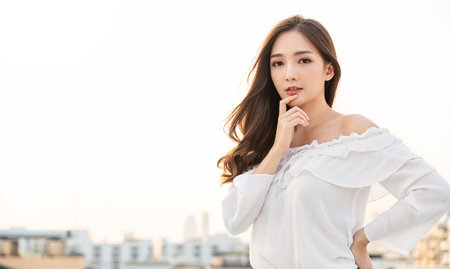 Portrait of young beautiful innocence asian woman in sky roof top. Smile face asian girl wear casual cloth. Beauty treatment perfect clear skin, japanese makeup asia woman, lifestyle conceptの写真素材