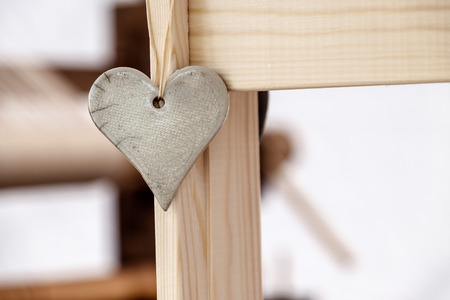 Stone heart shape on woodの写真素材