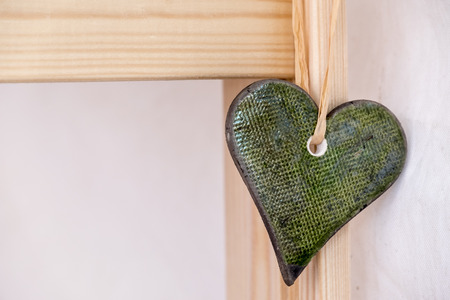 Stone heart shape on woodの写真素材