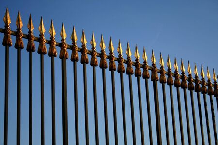beautiful golden speared gate in versailles, paris, franceの写真素材