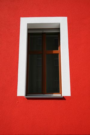 white window frame on red wall