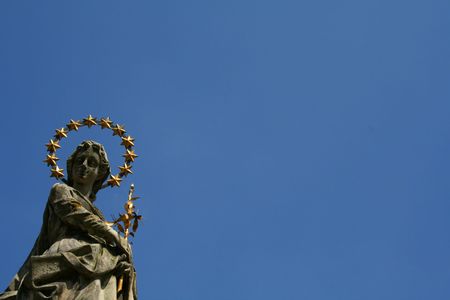 lady statue on skyの写真素材