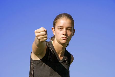 fist punch - attractive young woman practising self defenseの写真素材