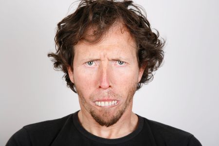 Portrait of an upset man with protruding teethの写真素材