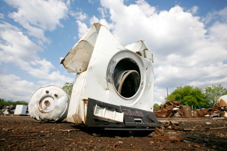 Old household appliances disposed of in metal scrapyardの写真素材