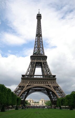 Eiffel tower on blue sky and green grass in summerの写真素材