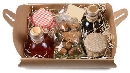 Food gift composition with liquor, jams and figs on white backgroundの写真素材
