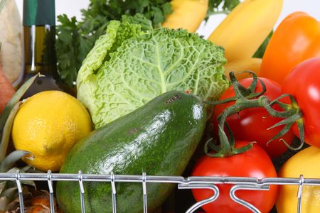 Shopping basket filled with fresh fruit and vegetablesの写真素材