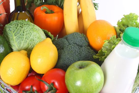 Shopping basket filled with fresh fruit and vegetablesの写真素材