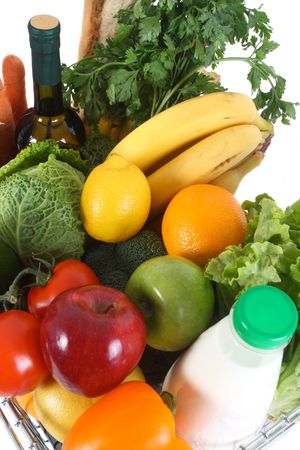 Shopping basket filled with fresh fruit and vegetablesの写真素材