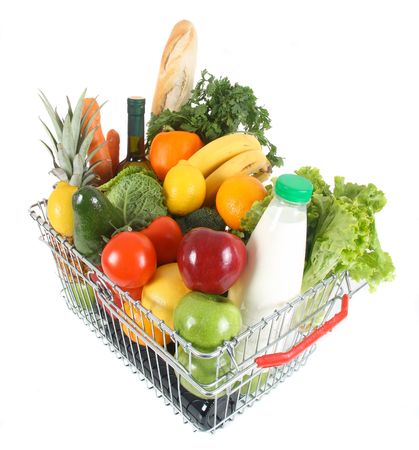 Shopping basket filled with fresh fruit and vegetablesの写真素材