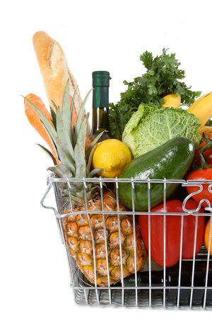 Shopping basket filled with fresh fruit and vegetablesの写真素材