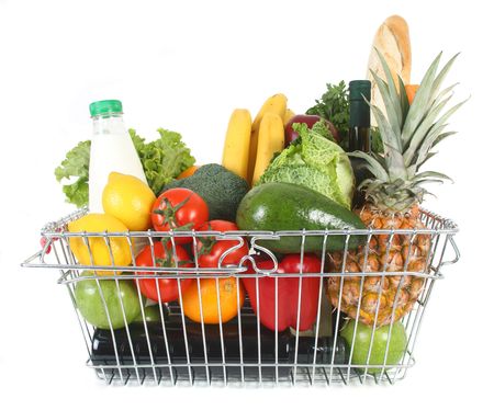 Shopping basket filled with fresh fruit and vegetablesの写真素材
