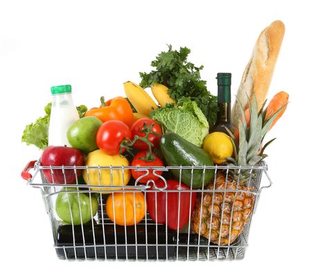 Shopping basket filled with fresh fruit and vegetablesの写真素材