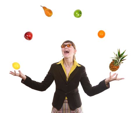 happy business woman juggling fruit on white backgroundの写真素材