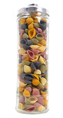Jar of colourful conchiglie pasta isolated on whiteの写真素材