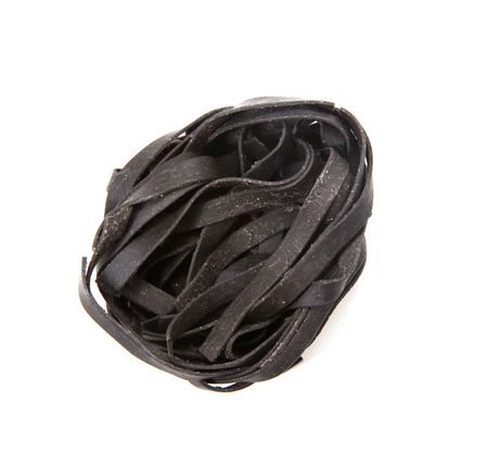 Squid ink black tinted twirl of a tagliatelleの写真素材
